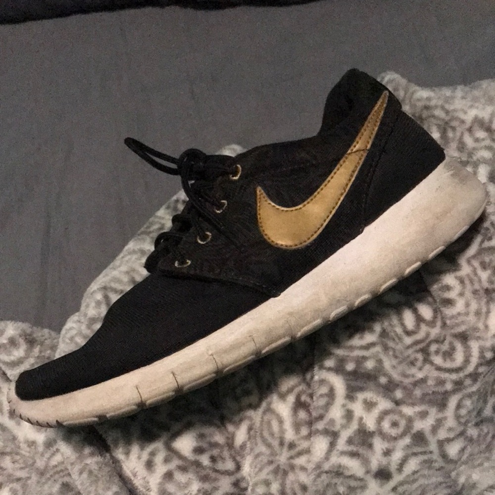 Black and gold nikes